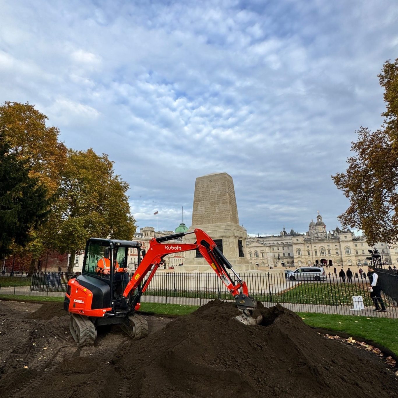 Live site groundworks at Horse Guards Parade, London Excavator carrying out groundworks on a live public site at Horse Guards Parade, central London