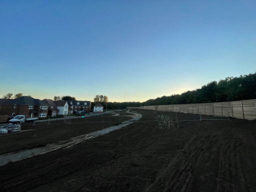 Large scale seed bed preparation across housing development site in Sittingbourne at dusk